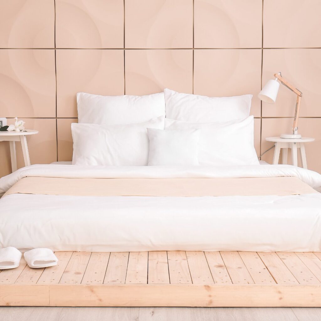 Light bedding with white textured duvet set in a bright bedroom.