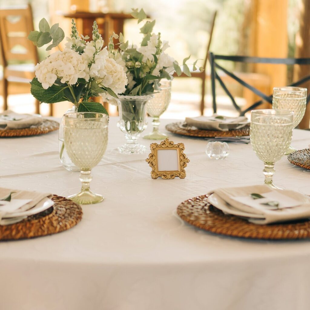 Summer dining table styled with placemats and lemon-themed napkins.